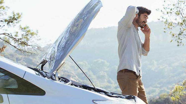 Man having a car mishap